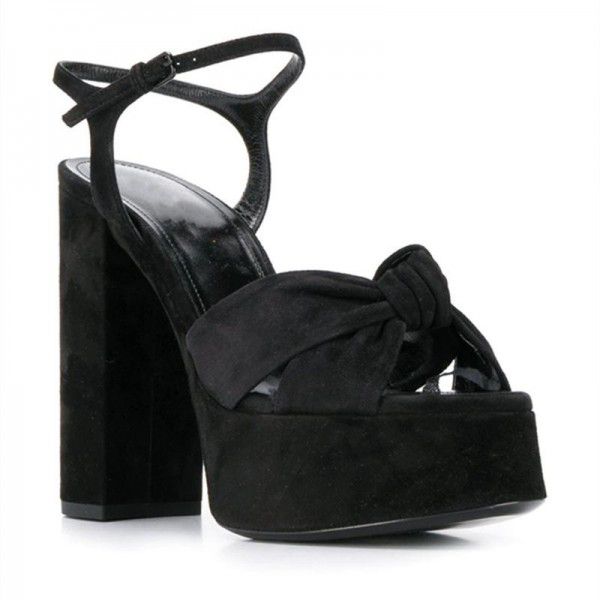 High heeled sandals with Roman straps and thick he...